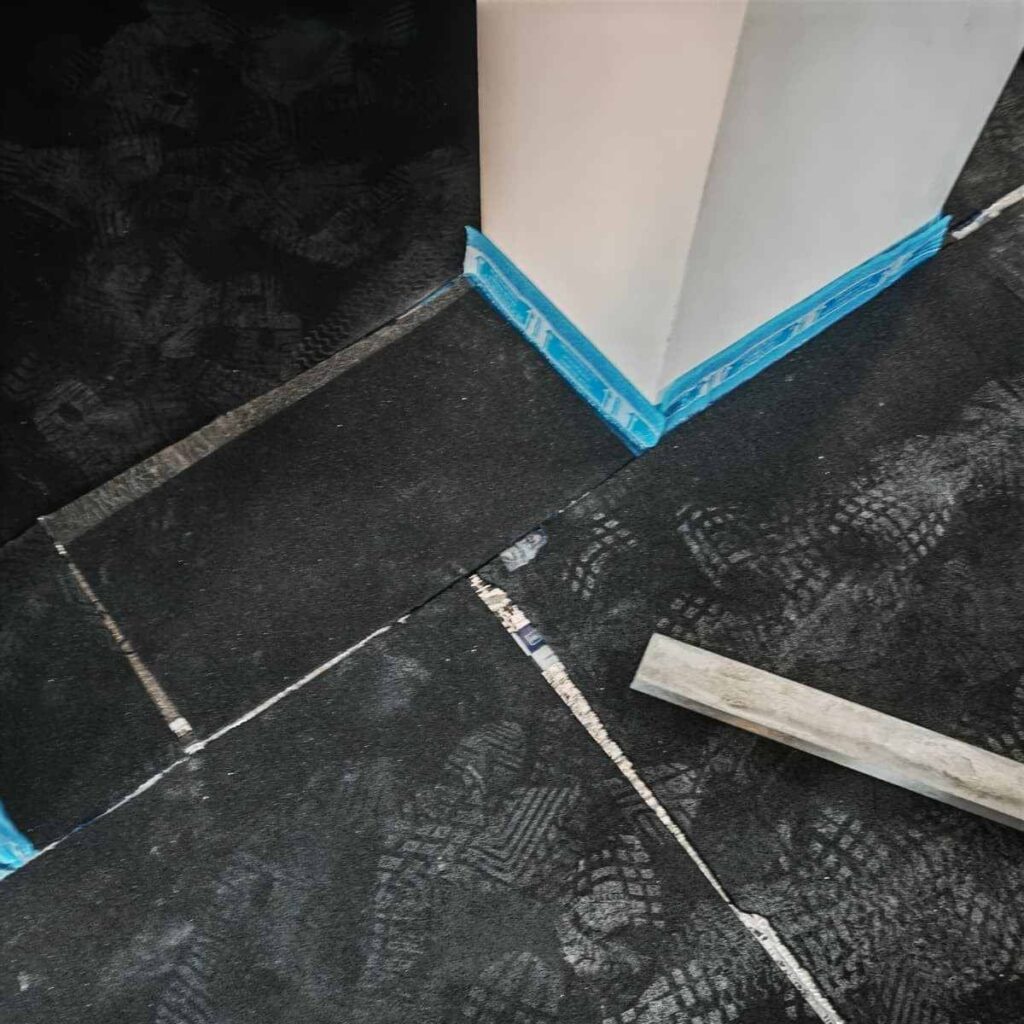 MGE installation on bathroom door corners