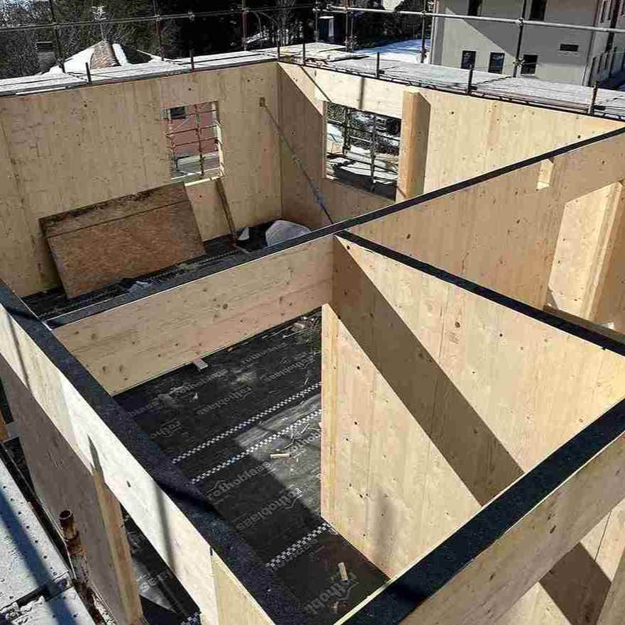 Aerial view of vertical wall structure with MGEF acoustic wall break strip